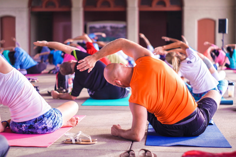 yoga class stretching on the floor